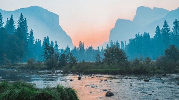 Quiet lake and mountains suggesting an even, calm breath